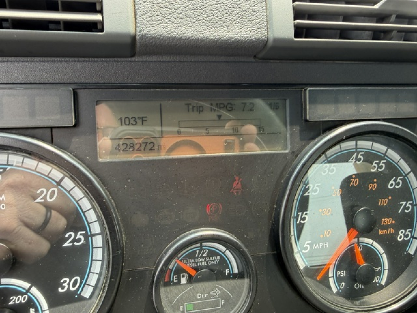 Dashboard view of 2017 Freightliner Cascadia CA125DC showing instrument cluster, speedometer, tachometer, and trip MPG display.