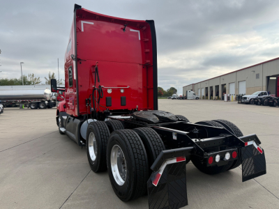 Kenworth T680 tractor rear view showing fifth wheel, dual rear axles, and red sleeper cab.