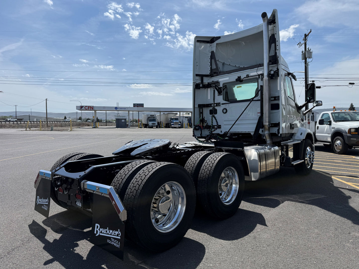 Mack AN64T conventional daycab tractor in-view showing rear chassis and sleeper cab, chassis and wheels visible.