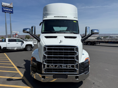 Front view of a white 2027 Mack AN64T conventional day cab truck showing large chrome grille with MACK letters and side mirrors.