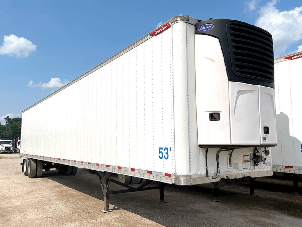 Front left side of a white Great Dane multi-temp refrigerated trailer with a black refrigeration unit at the front, blue 53' markings, and landing gear visible.