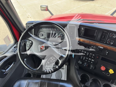 Interior of a 2019 International LT sleeper cab showing steering wheel, dashboard, and controls.