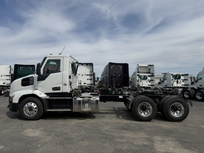 Mack AN64T conventional daycab chassis side view showing cab and bare chassis with rear axles.