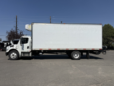 Freightliner M2106 refrigerated truck side view with box trailer and refrigeration unit