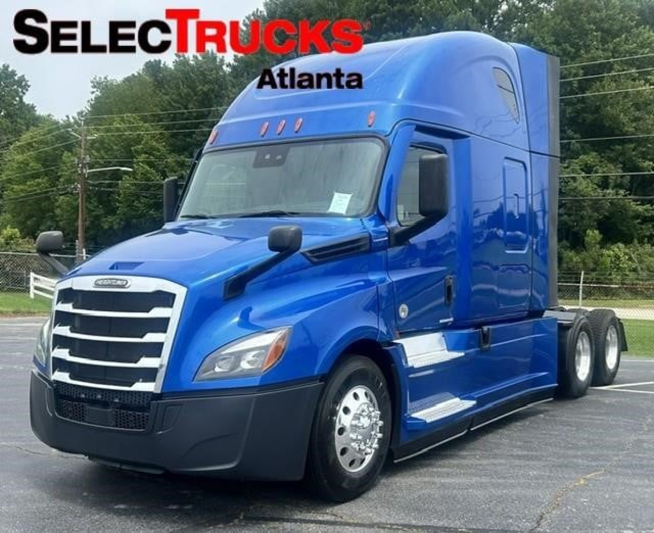 Freightliner Cascadia 126 sleeper cab truck in blue, front-right view with SelectTrucks Atlanta watermark.