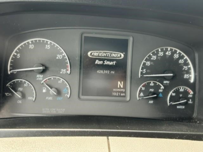 Freightliner Cascadia dash cluster with Run Smart display showing 429,592 mi and N gear; left gauge speeds/engine RPM, right gauges fuel, air, water; center screen Freightliner Run Smart.