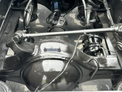 Freightliner Cascadia rear axle suspension and drive components in a sleeper tractor showing solid axlehousing and differential