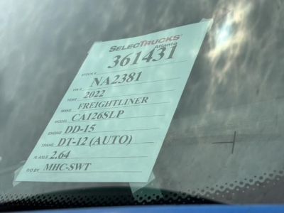 Sticker on windshield listing: Stock 361431, VIN NA2381, Year 2022, Make Freightliner, Model CA126SLP, Engine DD-15, Trans DT-12 (AUTO), Wheelbase 2.64, Body for MHC-SWT.