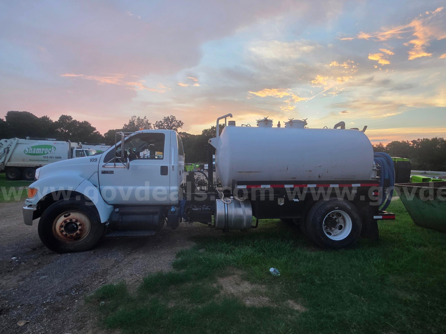 Ford F-750 vacuum truck with large cylindrical tank on a dual rear wheel chassis. Visible text includes VIN 3FRWF7FC3BV453772 on listing; no other legible labels on the image.