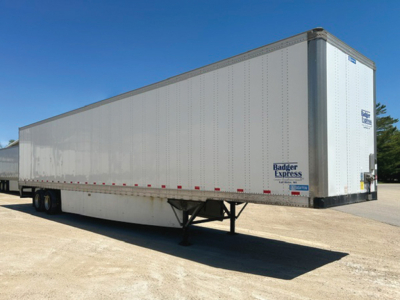 2016 Stoughton trailer side view showing tandem axle and rear doors with Badger Express logo.