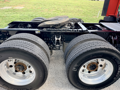 Kenworth T680 rear dual rear axle chassis with two large wheels and fifth wheel visible; no visible text due to image cropping.