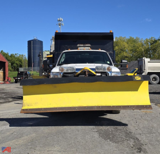 Front view of a Ford F-350 dump truck with a large yellow snow plow attached to the front bumper, winch line visible, plow edges prominent.