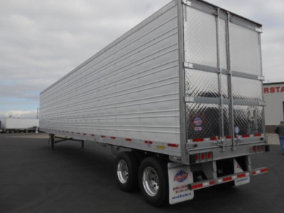 Trailer rear and side view of a 2026 Utility 3000R refrigerated trailer in silver with dual rear doors, reflective tape, and pair of axles.