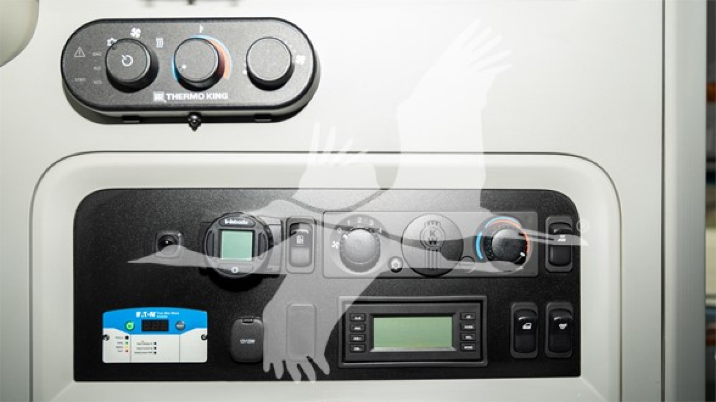Kenworth T680 truck dash and control cluster showing HVAC controls and digital display panel.