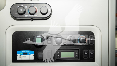 Kenworth T680 truck dash and control cluster showing HVAC controls and digital display panel.