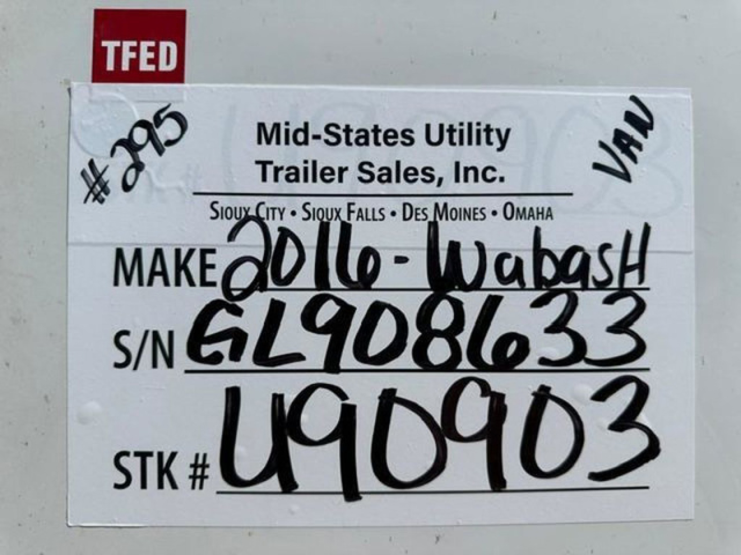 Trailer identification tag on mid-states utility trailer showing MAKE 2016-Wabash and S/N GL9086633 STK# U49003