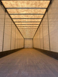 Wabash van interior trailer empty cargo area showing longitudinal ceiling beams and side walls