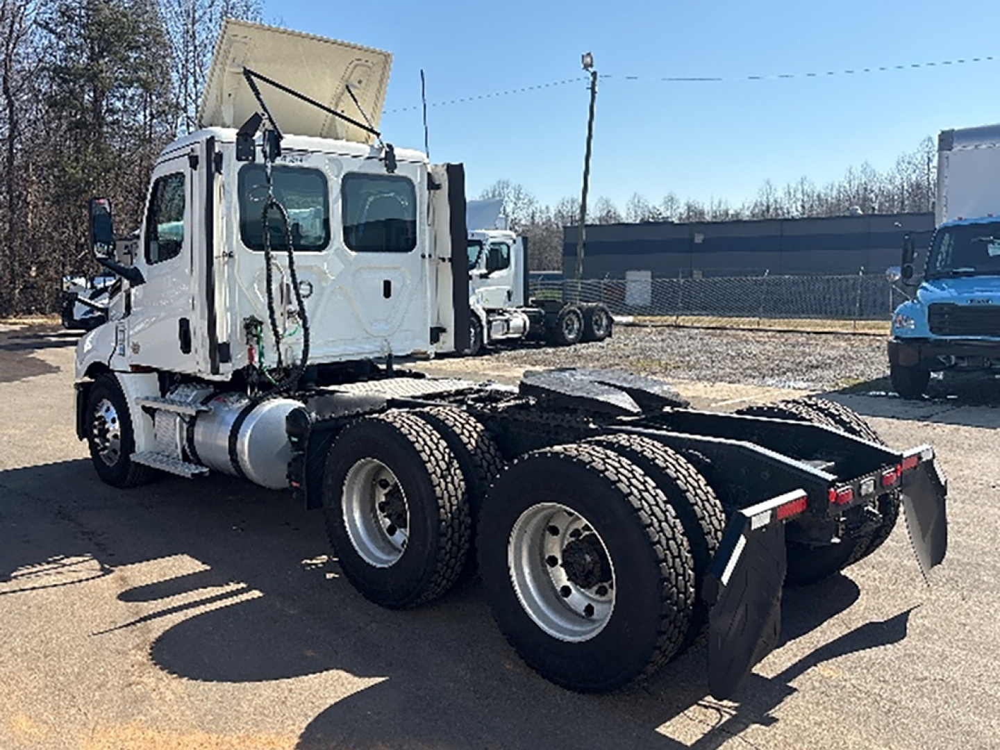 Freightliner Cascadia 126 sleeper cab truck chassis showing rear dual-axle configuration and fifth wheel area.