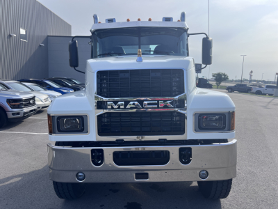 Mack PI64T front view showing grille with MACK lettering, large bumper, headlights, mirrors, and cab details.