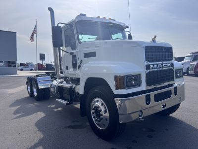 Mack PI64T truck in white facing left with front grille and chrome bumper; visible wheels and exhaust stack.
