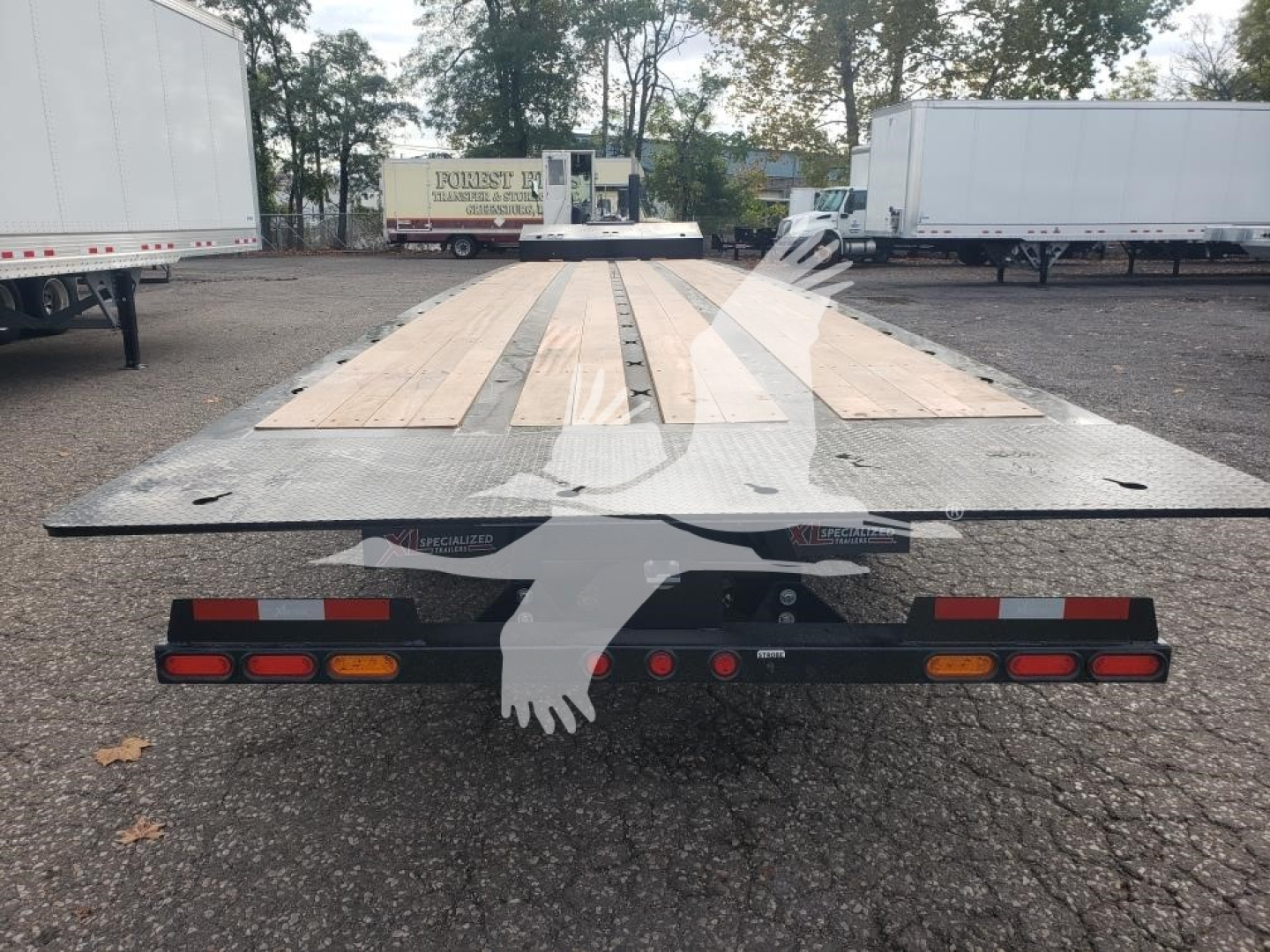 XL Specialized XL80SA trailer flatbed view from rear showing wooden deck and taillights.