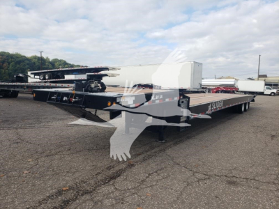 XL Specialized XL80SA traveling axle trailer showing flatbed with multiple axles and equipment, side decals reading XL80SA and SL024323.