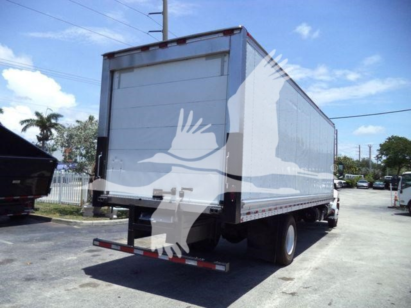 Hino 268A refrigerated truck rear/side view showing box cargo area and chassis.