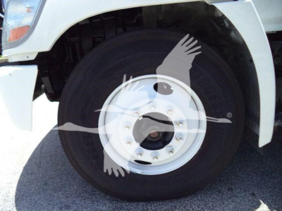 Front wheel of a refrigerated 2019 Hino 268A truck showing front tire and wheel with white fender