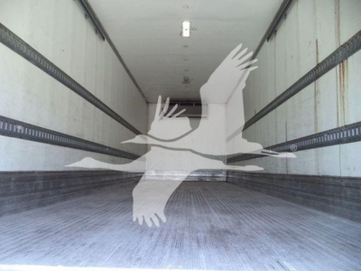 Interior of a refrigerated straight truck trailer with metal side walls and ribbed floor, empty with a watermark overlaid.