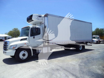 Truck: 2019 Hino 268A refrigerated box truck with cab and chassis side view, stock number 26198RFM.
