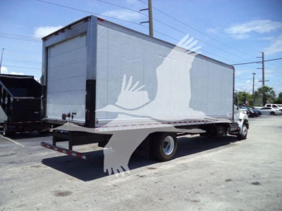 Hino 268A refrigerated box truck side view showing cargo box and rear underride bumper.