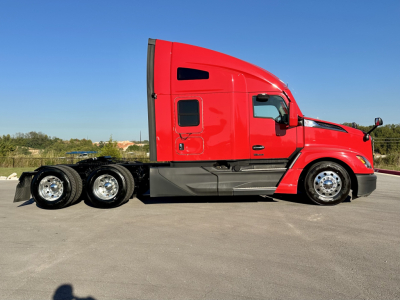 Kenworth T680 tractor from side view showing red cab and black chassis with sleeper, 6-wheel axle configuration.