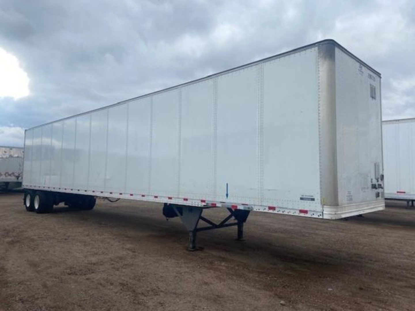trailer-type Hyundai van in-service showing long white dry van trailer with dual rear axles and hitch.