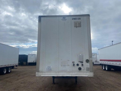 Rear view of a Hyundai trailer with identification numbers and small access panels visible on the back doors.