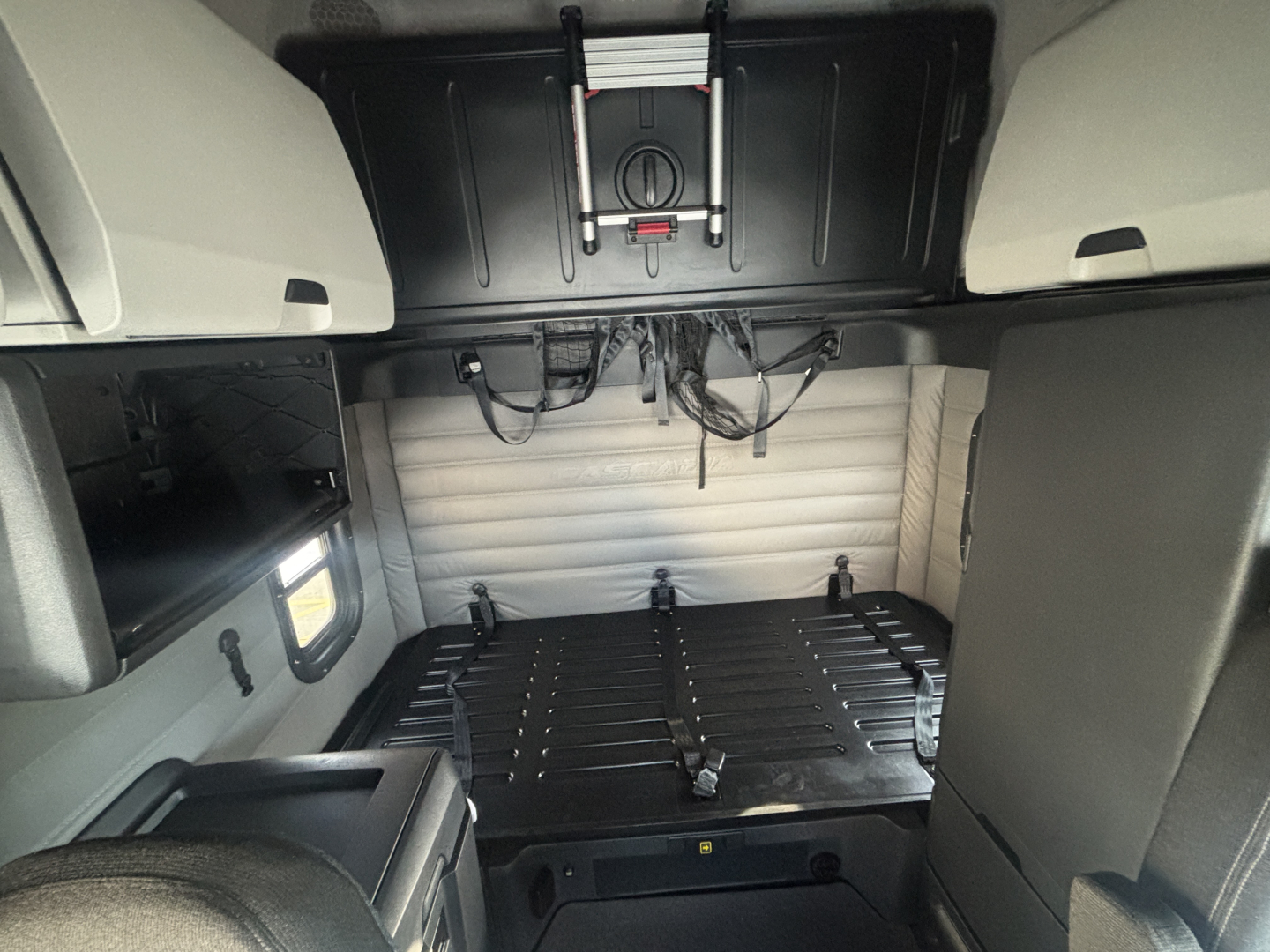 Freightliner PT126064ST cab interior showing cargo area and storage compartments.