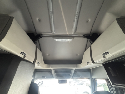Cab interior overhead view of Freightliner PT126064ST showing overhead storage cabinets and ceiling structure.