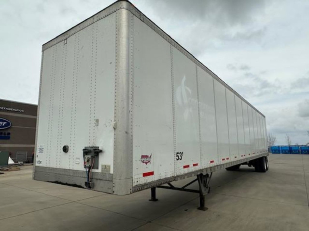 Trailer side and rear view of a 53' Wabash box trailer showing front landing gear and rear doors.