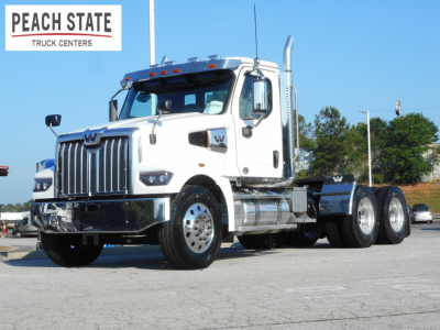 Western Star 49X day cab truck in white with chrome accents, front view, Peach State Truck Centers logo in the top left.
