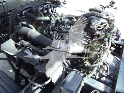 Isuzu NRR engine bay showing exposed components and hoses
