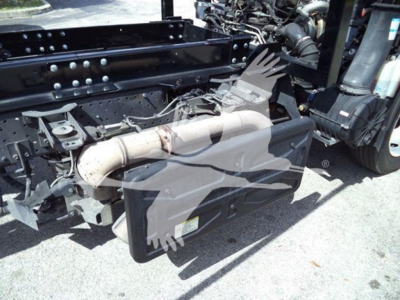 Isuzu NRR truck chassis with diesel exhaust aftertreatment and undercarriage components visible, including exhaust pipe and suspension; side view of frame and cab connection.