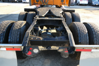 Peterbilt 579 chassis viewed from rear with fifth-wheel and dual rear axles, heavy-duty hitch, and dual rear tires visible under truck frame.