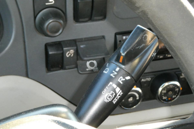 Peterbilt 579 truck steering column with gear selector stalk and dashboard controls visible in cab interior