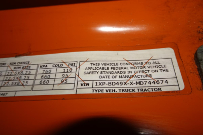 Vehicle label showing VIN 1XPBD49XXMD744674 and text about federal safety standards; also shows ‘TYPE VEH. TRUCK TRACTOR’ and various spec fields.