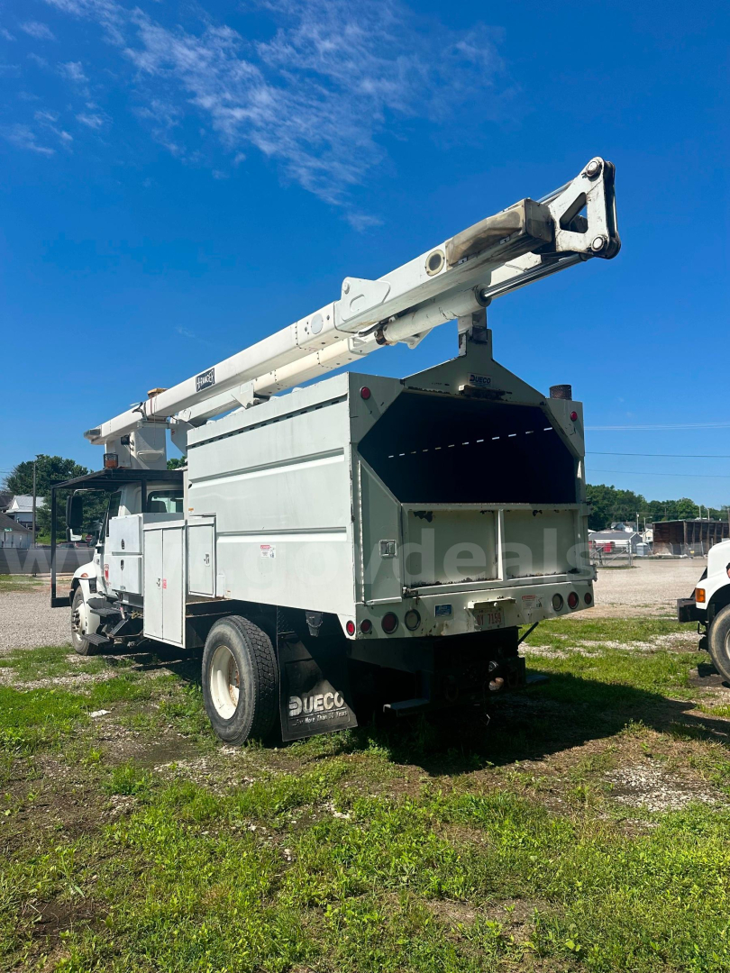 Bucket truck in service with extends rear hopper and crane arm visible, side view.