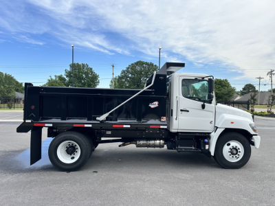 Hino L7 dump truck side view showing cargo bed and cab, VIN 5PVNV7AJXS5T50068, stock 66566, category cab and chassis, new condition.