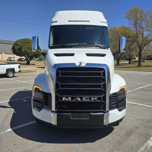 Mack PR64T76M truck front view showing grille, headlights, and hood emblem.