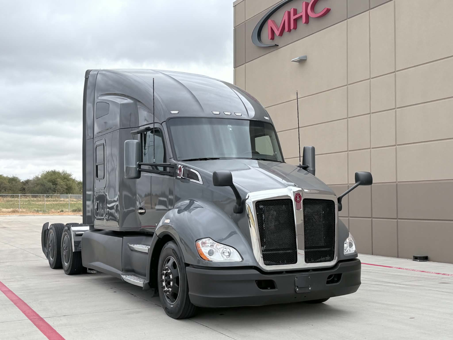 Kenworth T680 truck front-left view showing sleeper cab, grille, and badge area with no visible fluids or labels readable.