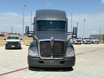Kenworth T680 truck front view showing large grille, dual headlights, wide windshield, and mirrors.