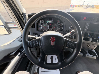 Kenworth T680 interior steering wheel and dashboard view with gauges and controls visible.