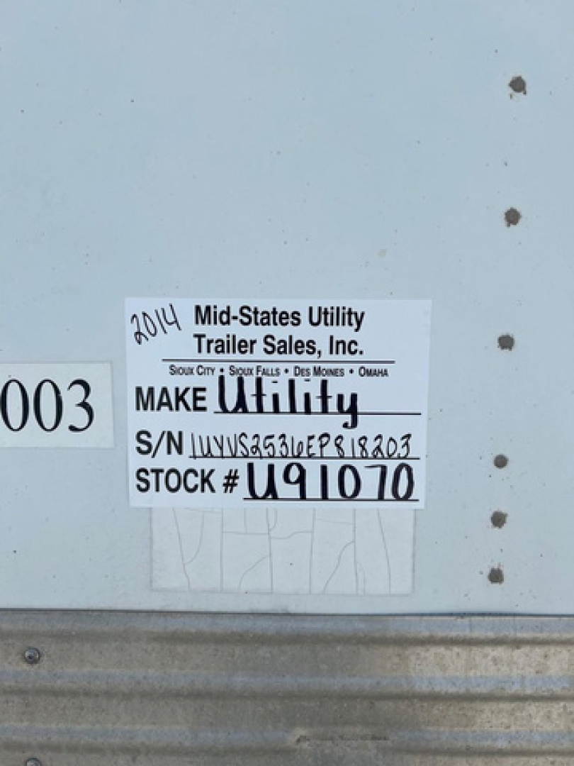 Label on trailer showing 2014 Mid-States Utility Trailer Sales, Inc. make Utility, S/N JUVS2536EP818203, STOCK U91070.